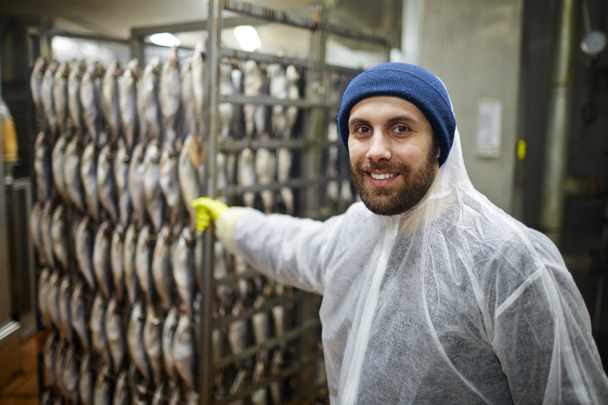 Food production worker in a smokehouse - ERP for food companies